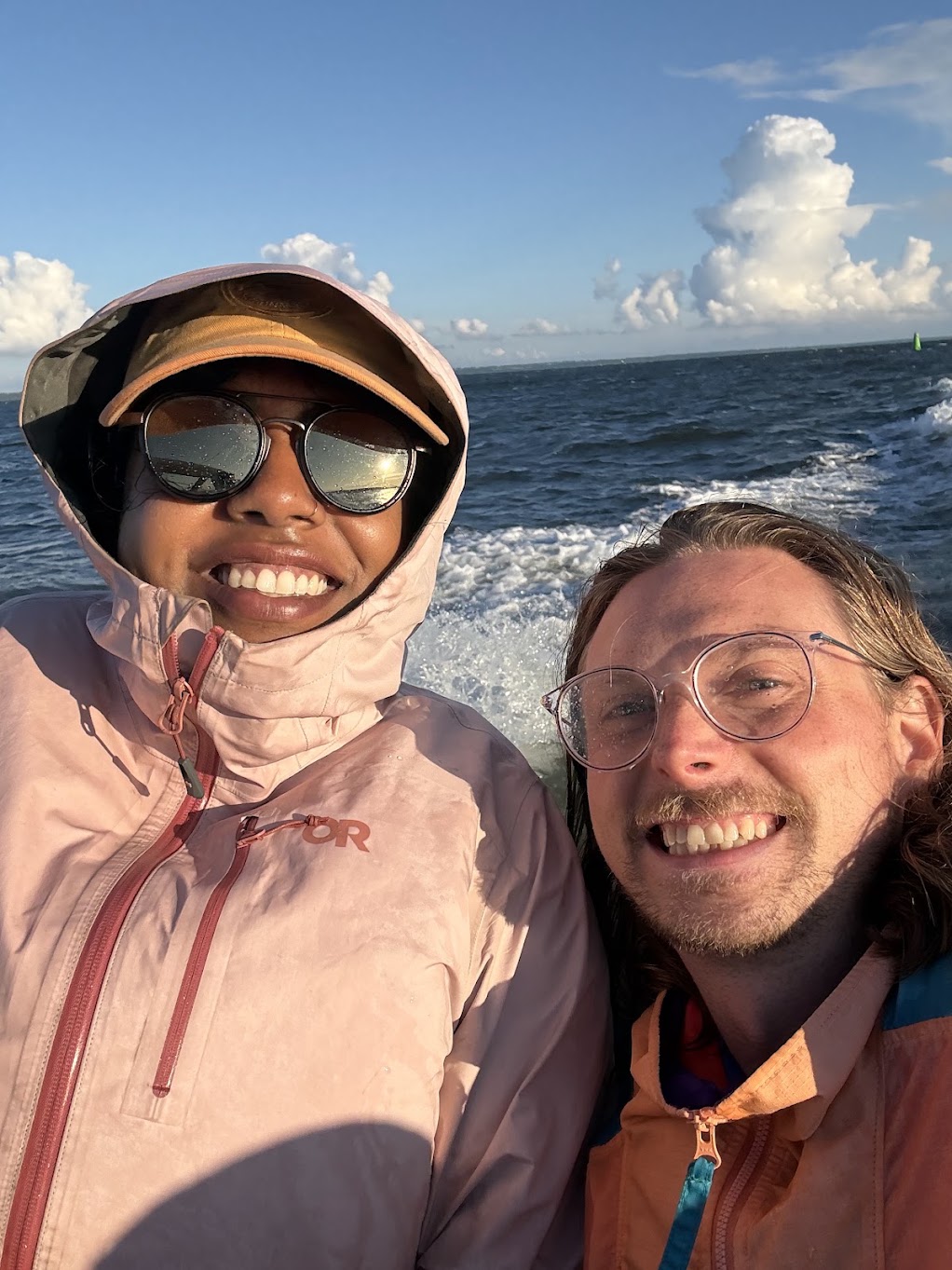 Jessica and Emil smiling on a boat