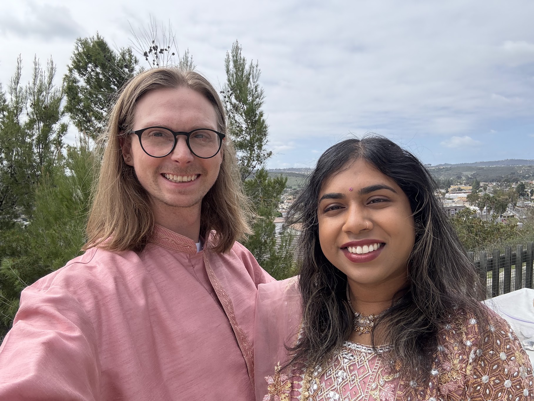 Jessica and Emil dressed in pink at a celebration